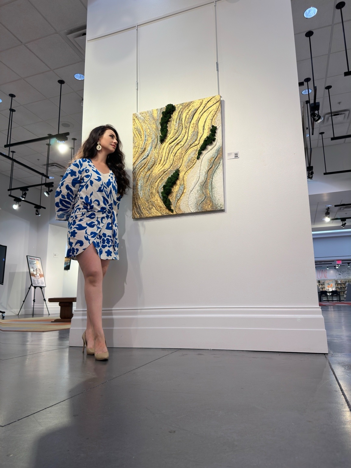 Liubov Untila beside Golden River in a gallery